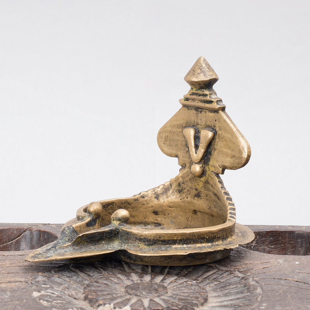 Vintage brass 19th century Laxmi Lamp South Indian Tamil style close up side view 